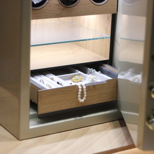 Security metal safe with pearl necklace, diamond jewelry and exp